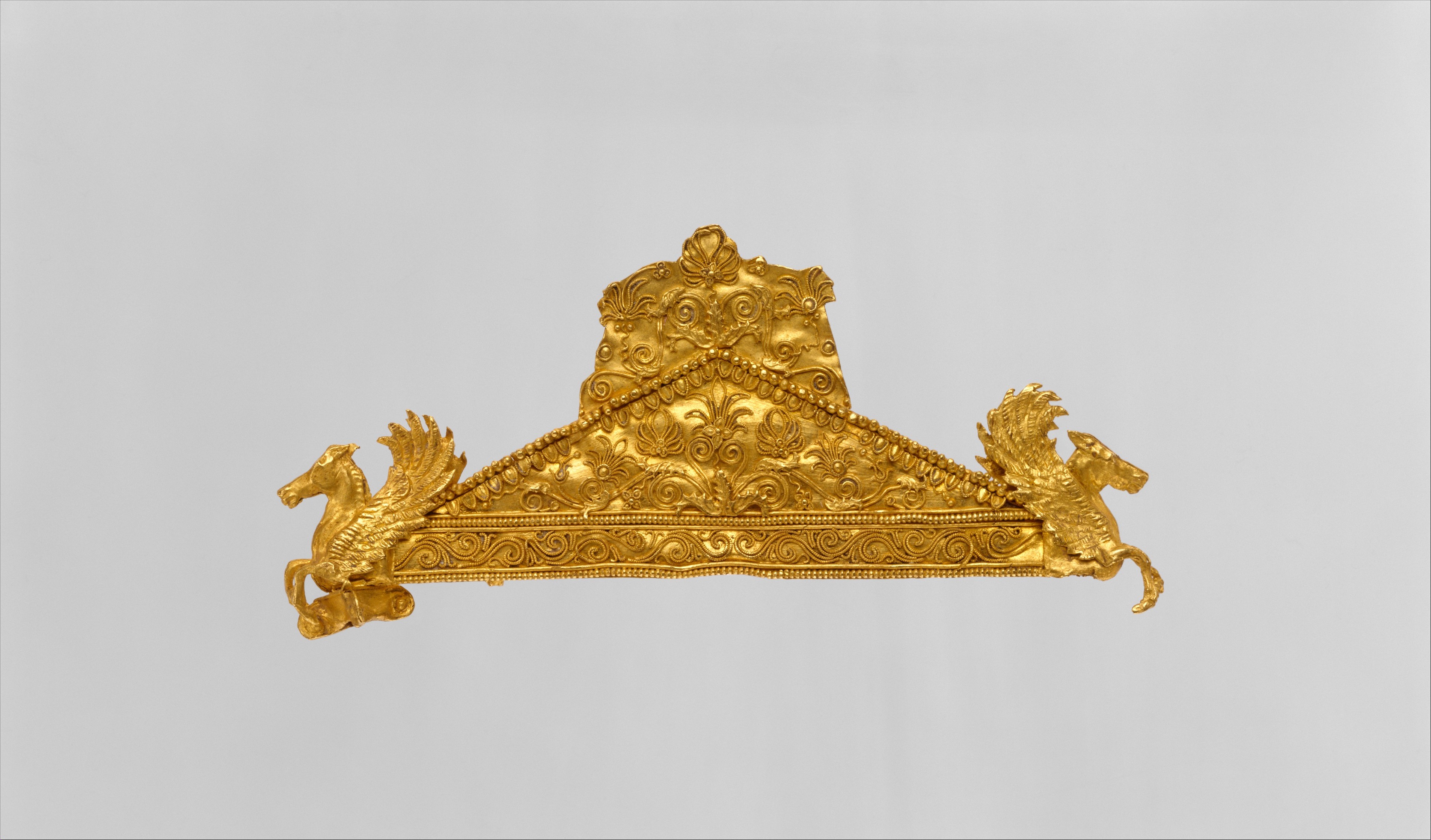 Gold pediment-shaped brooch