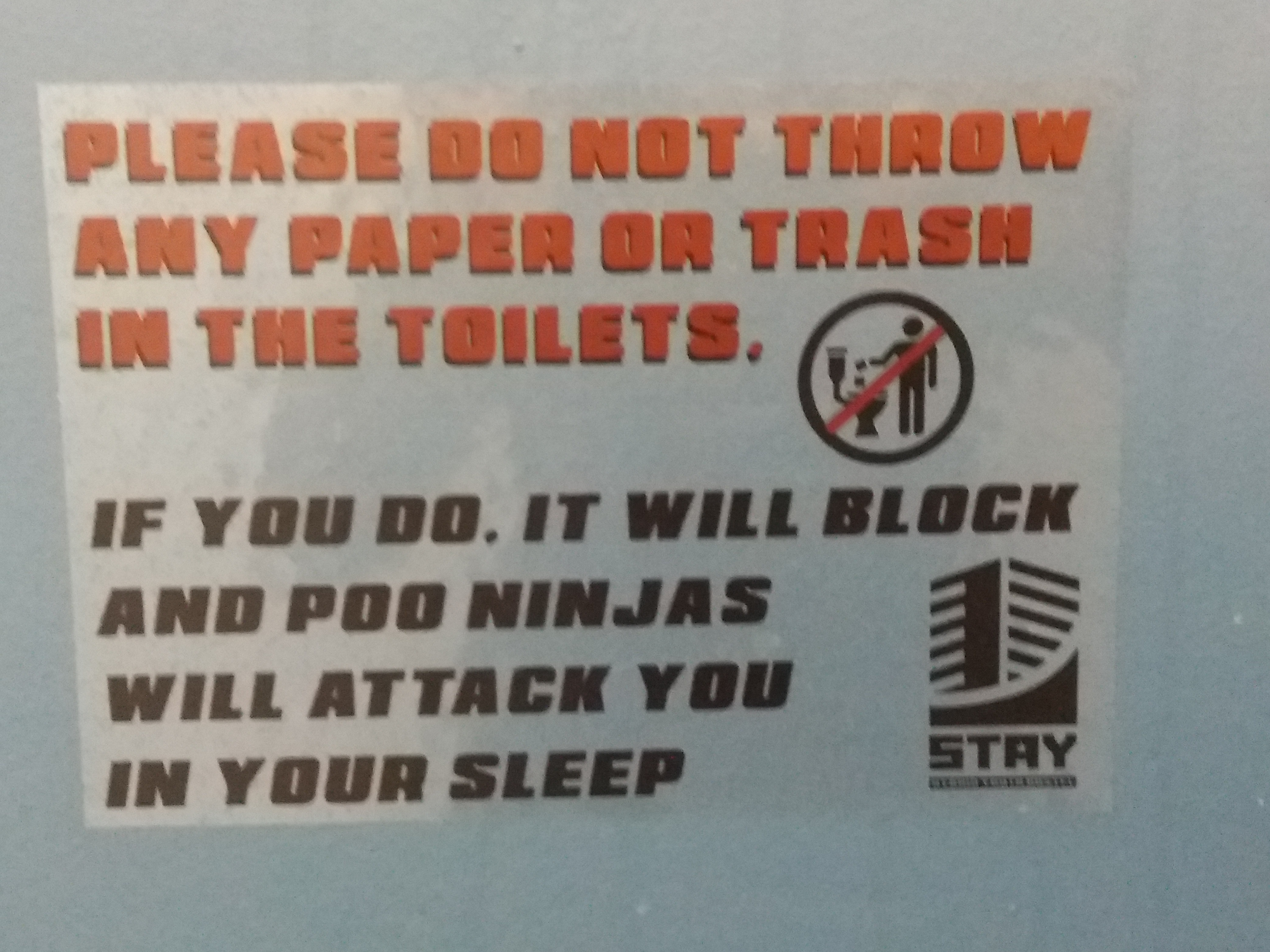 Humorous information poster in Stay Hybrid Guesthouse, Thessaloniki, 1
